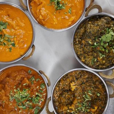 Assorted Indian curries on a table.