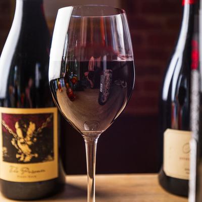 Bottles and a glass of red wine