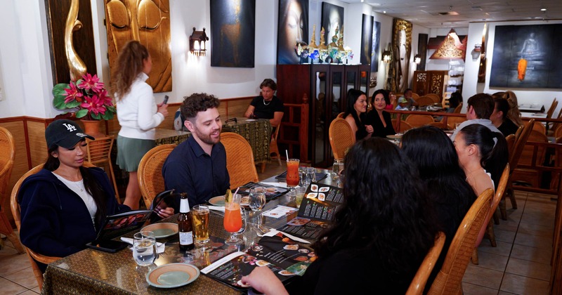 Diner area, tables and chairs, people eating