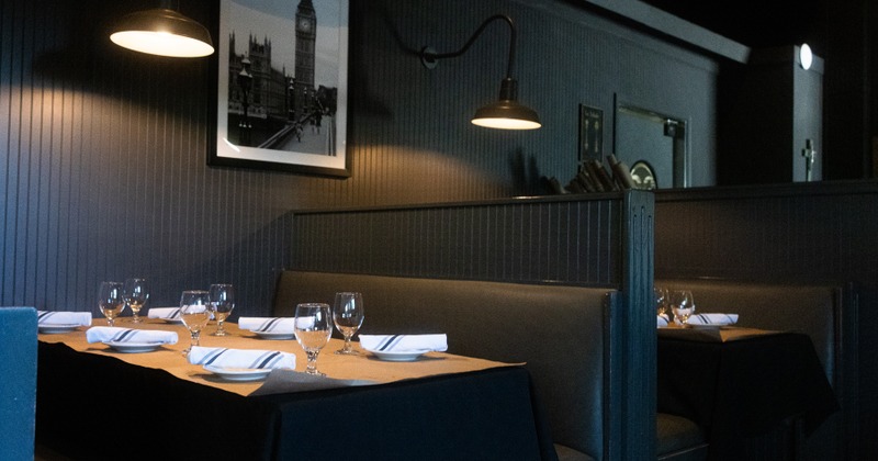 Dining booths with set tables prepared for guests