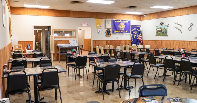 Spacious and cozy interior dining area with dining tables ready for guests