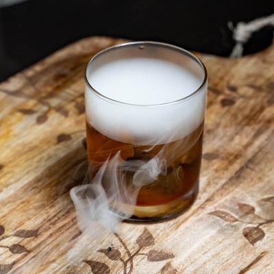 Smoked old fashioned cocktail, served.