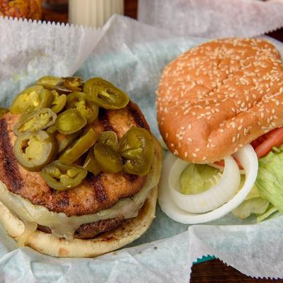 Double sausage patty sandwich, with Swiss, jalapenos, onion, lettuce, and tomato.