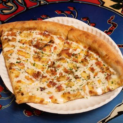 Chicken Bacon Ranch pizza slices.