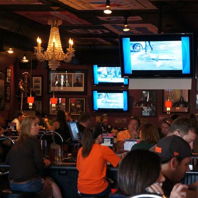 Patrons sitting watching the game