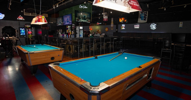 Interior, pool table with bar in the back