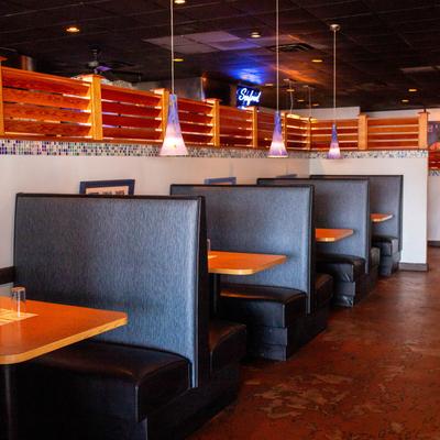Restaurant booths with tables designed for wheelchair accessibility