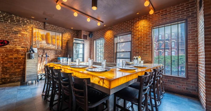 A rustic dining room with a large wooden table