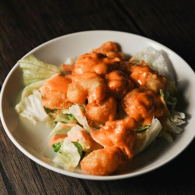 Crispy, fried shrimp tossed in a creamy sauce.