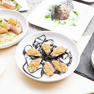 Mussels, stuffed with breadcrumbs and grated cheese