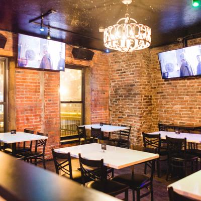 Interior, seating area, TVs on the walls