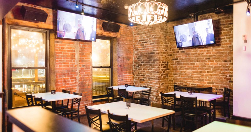 Interior, seating area, TVs on the walls