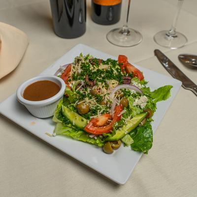 Greek salad with dressing on the side.