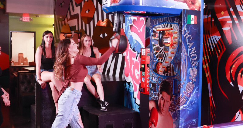 Guests hitting a Punch Boxing Machine