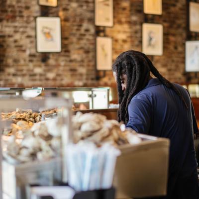 Employee tending the bar.