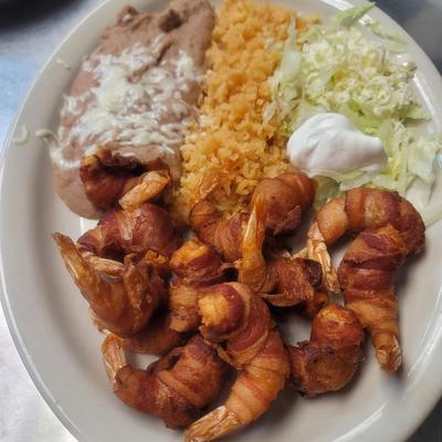 Fried shrimp wrapped in bacon.