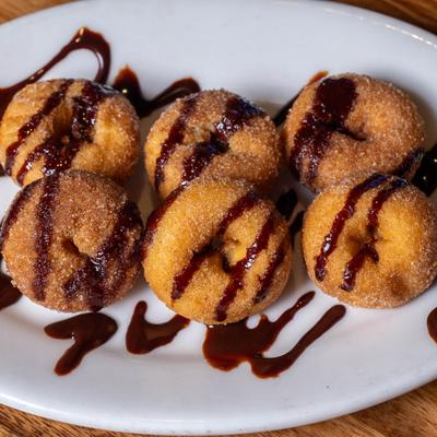 Mini donuts with chocolate.
