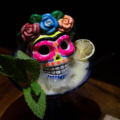 Served cocktail with colorful skull.