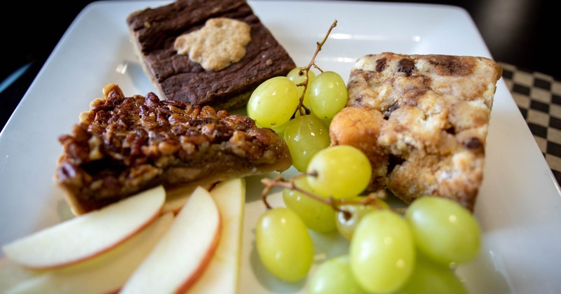 Assorted baked goods and fresh fruit