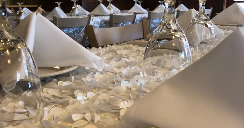 Table setting with napkins and glassware, close-up