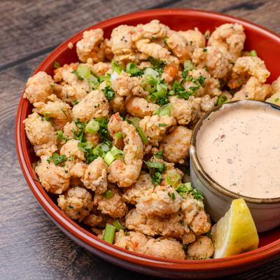 Fried crawfish tails topped with scallions, served with chipotle ranch sauce.