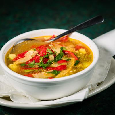 Sopa de tortilla with vegetables closeup