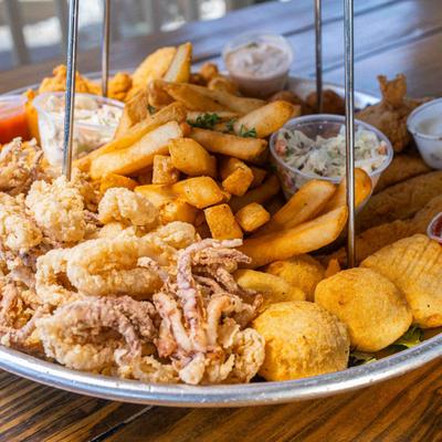 Different seafood on seafood tower.