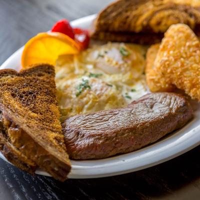 Steak and eggs, with toast.