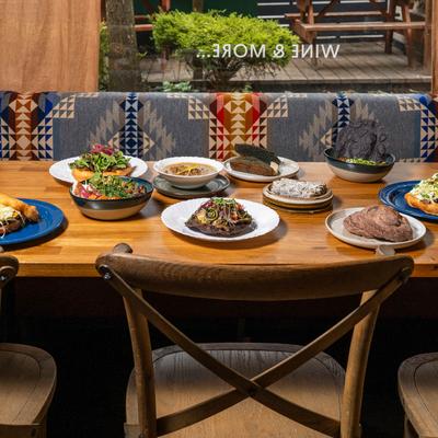 Vibrant dishes arranged on a wooden table.