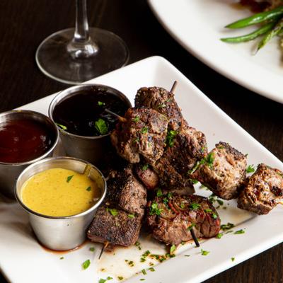 Beef skewers, with peppercorn, sweet and spicy BBQ sauce, honey mustard, and bourbon glaze
