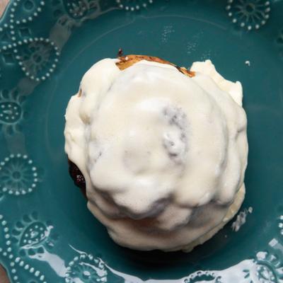 Cinnamon roll with cream cheese icing.