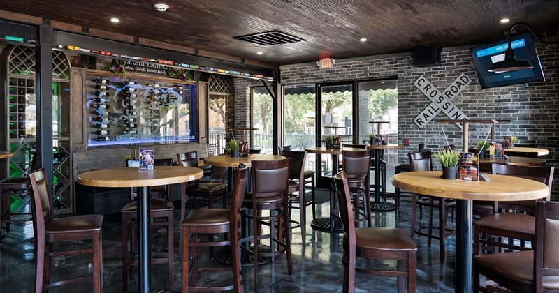 Interior, seating area with high tables and stools