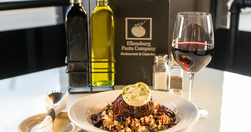 Filet Mignon on a bed of risotto, and red wine