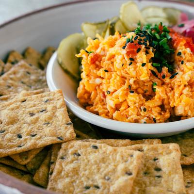 Pimento Cheese Dip served with sesame rice crackers.