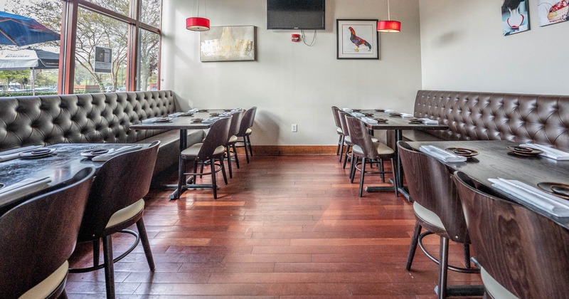 Interior, long leather bench seating with lined up tables and chairs