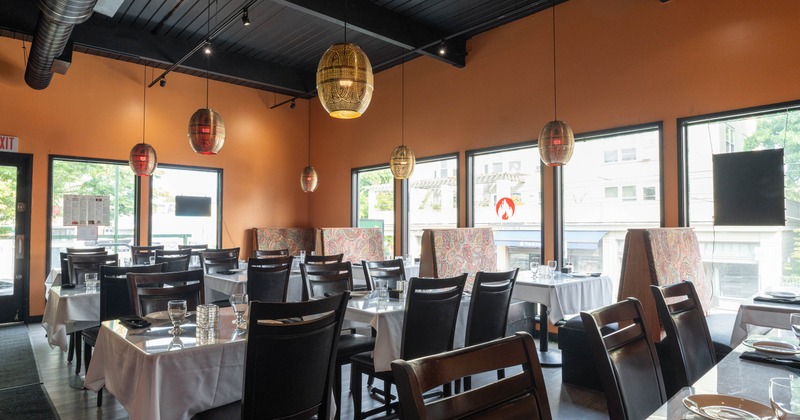 Interior, tables and chairs in dining area