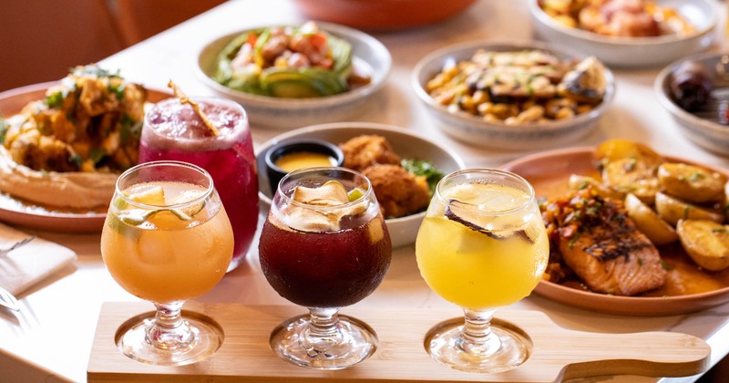 Sangria flight and assorted dishes on a table