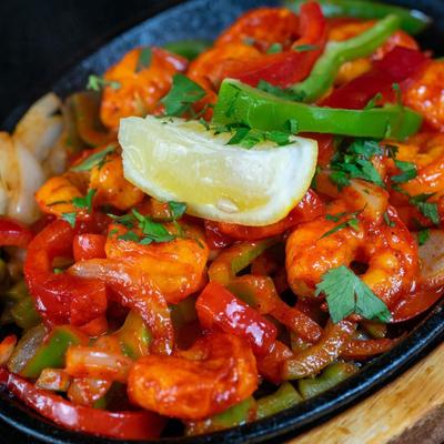 Marinated shrimp mixed with red and green bell peppers and onions.