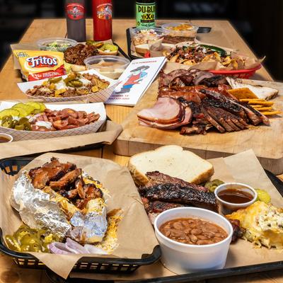 Table spread with assorted food dishes.