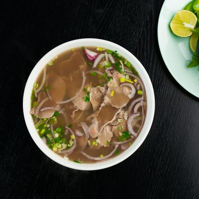 Vietnamese beef noodle soup, top-down view.