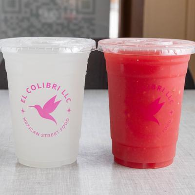 Two chilled drinks served in clear cups.
