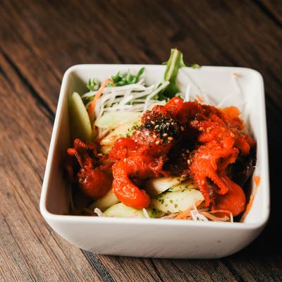 A bowl of marinated octopus salad.