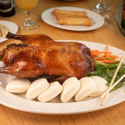 Peking Duck served with steamed buns.