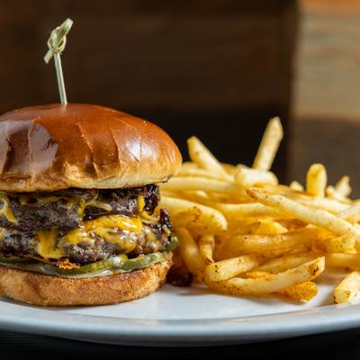 Maple bacon jam burger served with crispy fries.
