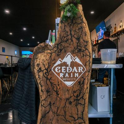 Wood carving with the company logo.