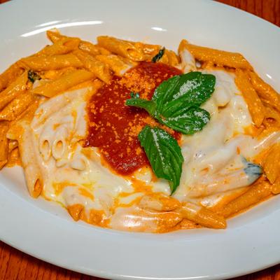Baked Ziti topped with mozzarella basil and marinara.