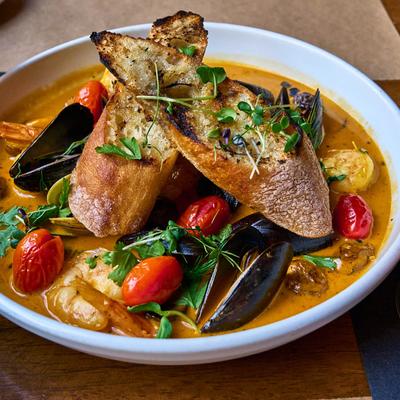 Seafood in a tomato, fennel , and saffron broth.