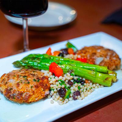 Baked crab cake with asparagus and couscous.