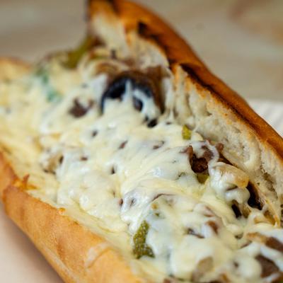 Philly cheesesteak sandwich, close-up.