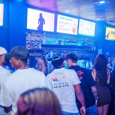 Lots of guests at the bar.